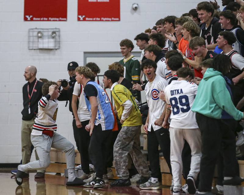 Yorkville's student section reacts after a score during their basketball game between Oswego at Yorkville Friday, Dec 12, 2025 in Yorkville.