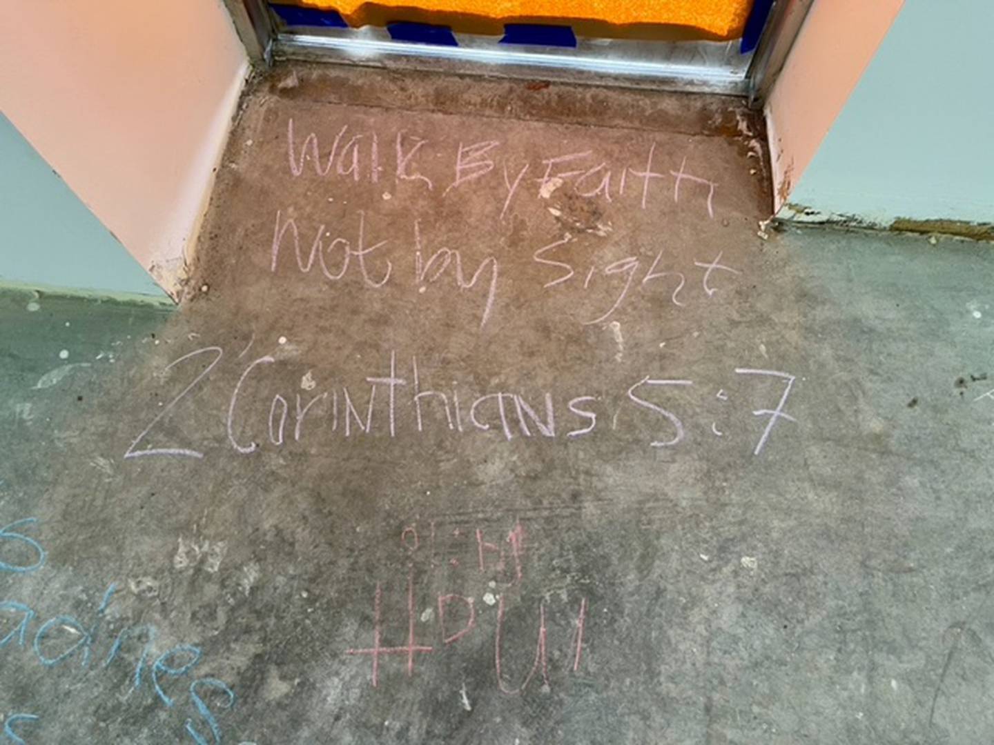 During The Way Church of Joliet's first prayer service at its new space on Theodore Street in Joliet, members wrote Bible verses on the bare floor.