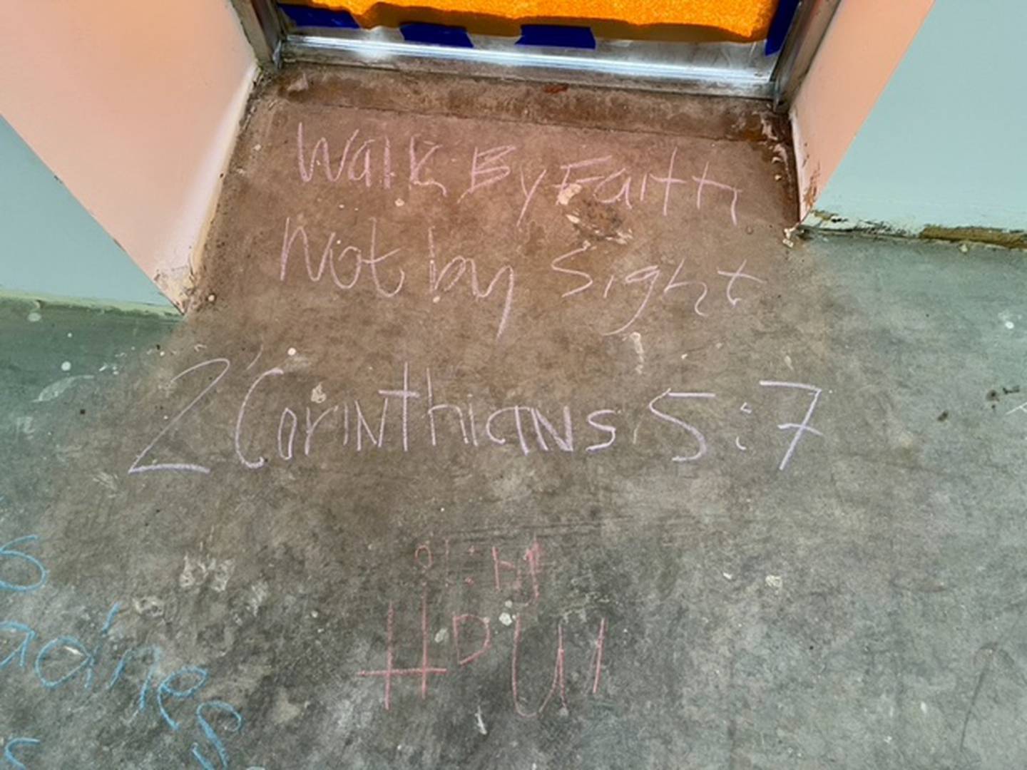 During The Way Church of Joliet's first prayer service in its new space on Theodore Street in Joliet, members wrote scripture verses on the bare floor.