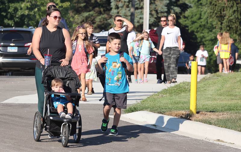 Students and their parents begin to arrive at school Wednesday, Aug. 17, 2022, on the first day at North Elementary in Sycamore.