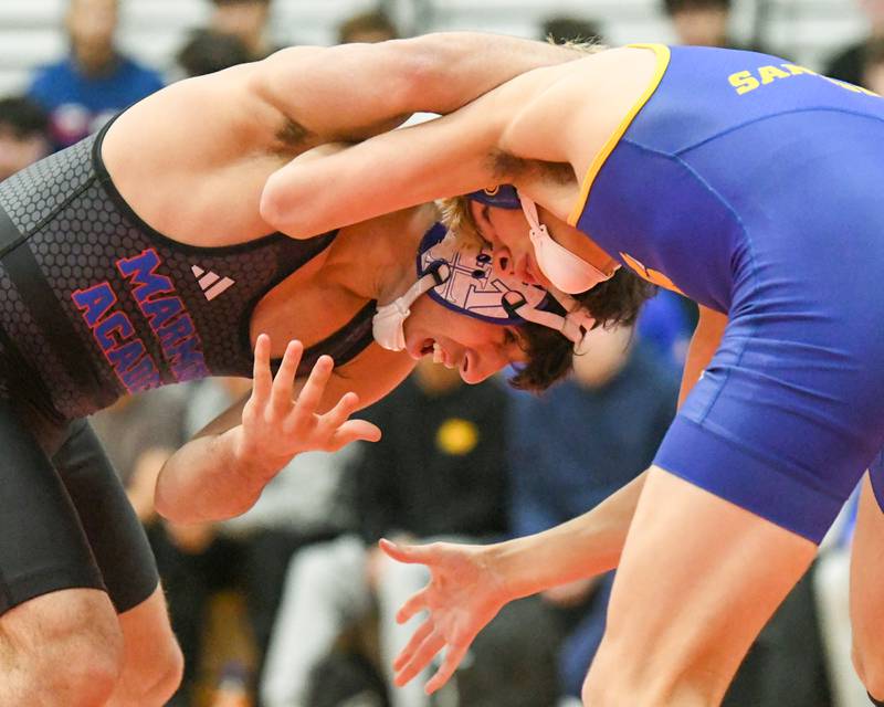 Zach Steward of Marmion Academy, left, goes head-to-head in the regional meet on Tuesday Feb. 25, 2025, while taking on Brady Ritter of Sandburg in the 144-weight class held at Yorkville High School.