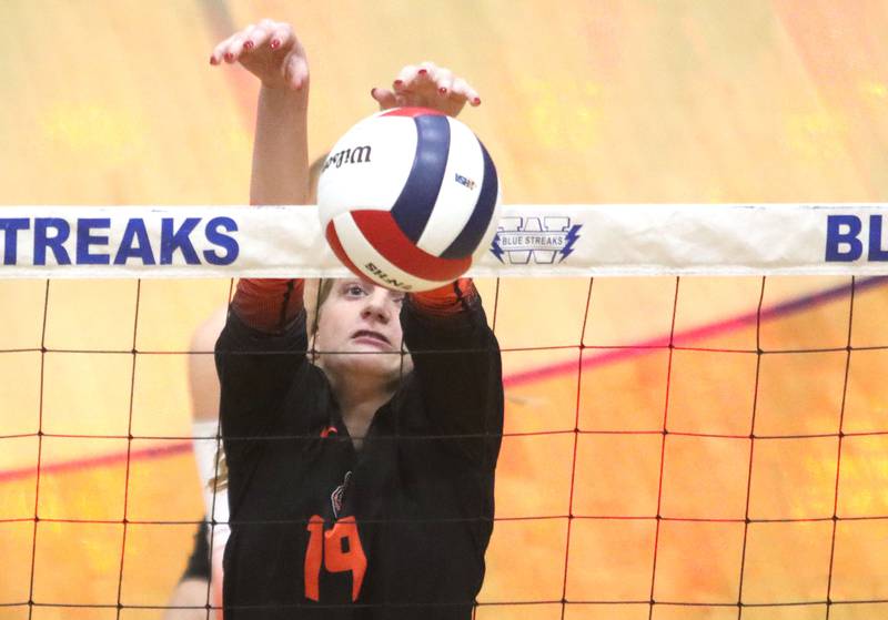 Crystal Lake Central’s Alexis Hadeler blocks the ball against Woodstock North in IHSA girls volleyball Class 3A Regional action at Woodstock High School in Woodstock on Thursday, October 30, 2025.