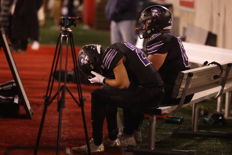 Downers Grove North’s Noah Battle hangs his head in the final second in the Trojans’ loss against Mt. Carmel in the Class 7A championship on Saturday, Nov. 25, 2023 at Hancock Stadium in Normal.