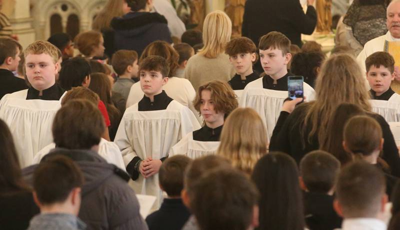 Students with Trinity Catholic Academy, Peru Catholic School and Holy Family School in Oglesby serve Mass during an All Schools Mass on Thursday, Feb. 20, 2025 at St. Patrick's Catholic Church in La Salle. The bishop announced a new name for the three schools calling it Carlo Acutis. Last year, the Catholic Diocese of Peoria announced the consolidation of the three schools. Carlo Acutis Canonization will take place on Sunday, April 27, 2025 during the Jubilee of Teenagers in Rome. Acutis is the first millennial saint, representing those born between the early 1980's and the late 1990's. He is celebrated for cataloging miracles and online and managing websites for Catholic organizations.