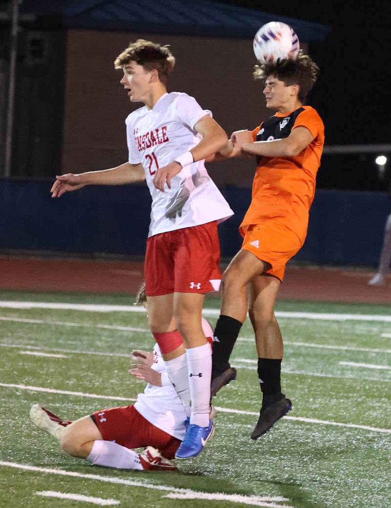 Hersey's Teddy Reyes heads the ball behind Hinsdale Central's Kostas Zamalaitis Friday, Nov. 8, 2024, during their Class 3A state semifinal game at Hoffman Estates High School.