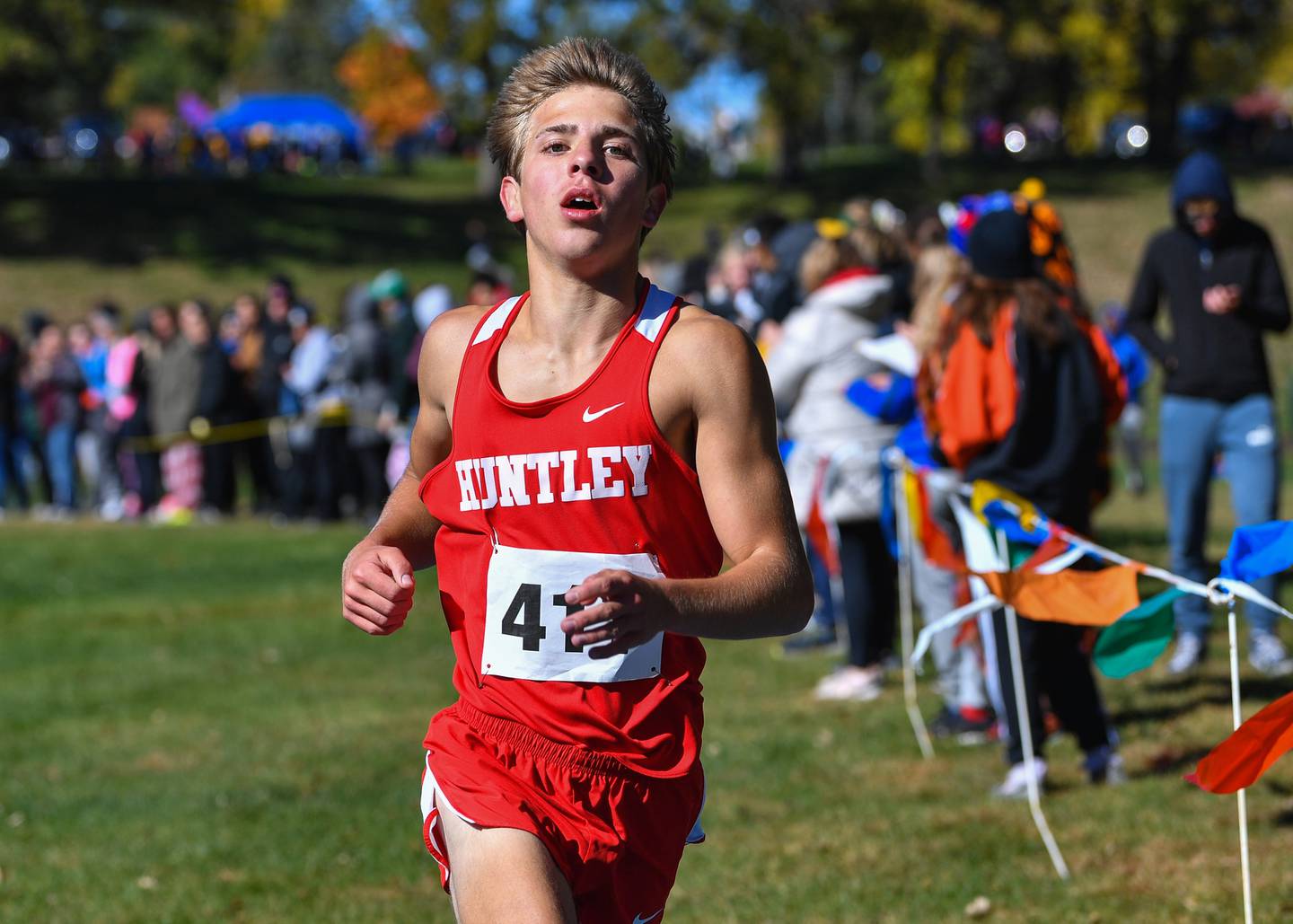 Huntley's Tommy Nitz crosses the finish line to finish first in the Fox Valley Conference boys cross country meet at Veteran Acres Park on Saturday, Oct. 15, 2022 in Crystal Lake.