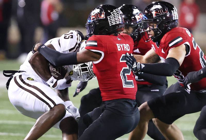 The Northern Illinois defense rallies at the ball to bring down Western Michigan's Leroy Thomas during their game Tuesday, Nov. 14, 2023, in Huskie Stadium at NIU in DeKalb.