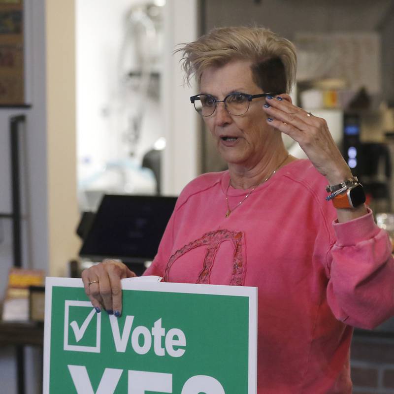 Donna Rasmussen talks with other veterans on about voting on raising the sales tax to fund mental health on Friday, March 8, 2024, at the Other Side in Crystal Lake, during a meeting of area veterans.