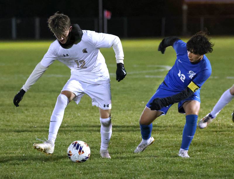 Sycamore's Andre Crouch (left) tries to keep the ball away from Burlington Central’s David Mancera Tuesday, Oct. 21, 2025, during their IHSA Class 2A regional semifinal match at Burlington Central High School.