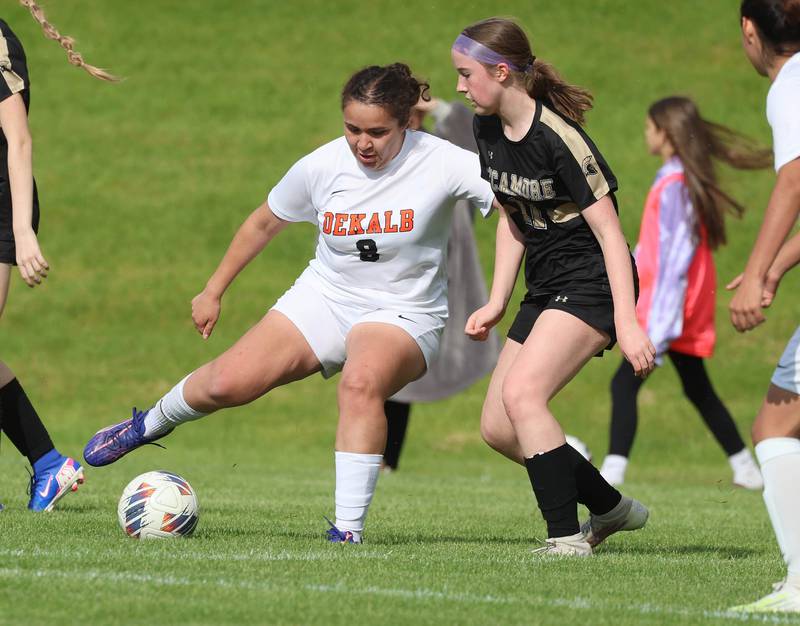 DeKalb's Alexia Ortiz tries to get by Sycamore's Ellie Lawless Thursday, May 7, 2026, during their game at Sycamore High School.
