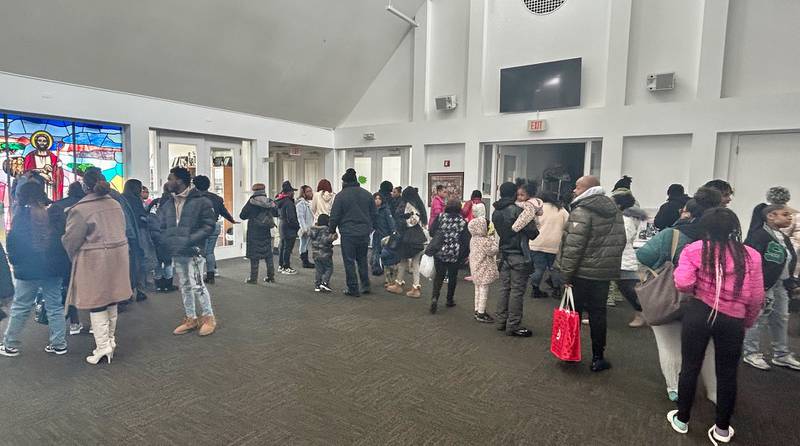 A crowd peruses work presented by New Hope Missionary Baptist Church's youth during the "Displays of Excellence" presentations on Sunday, Feb. 16, 2025. The displays were part of the church's annual Black History Month programming.