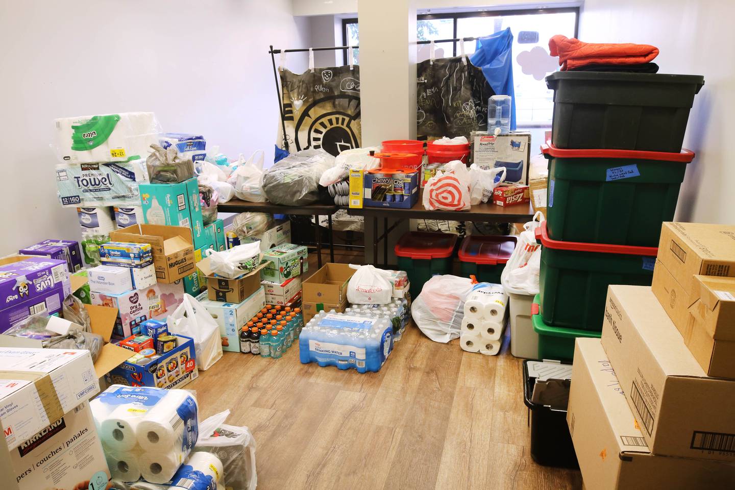 Piles of donated goods Wednesday, Oct. 9, 2024, at the Sycamore City Center await transportation to Asheville, North Carolina for those affected by by the devastation Hurricane Helene. DeKalb County residents have been generous in their donations at several drop-off spots in the county.