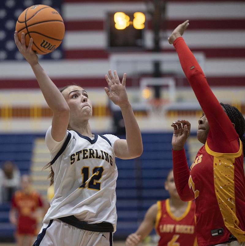 Sterling’s Macie Lofgren puts up a shot against Rock Island’s Ka'zaria Bell Tuesday, Nov. 25, 2025.