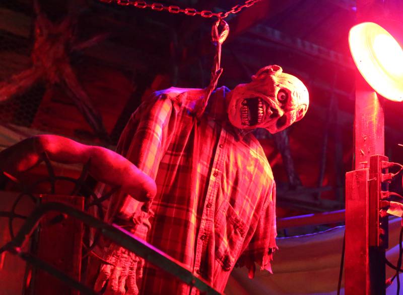 A character illuminates in a red light during the Nightmare Haunted Attraction on Saturday, Oct. 14, 2023 at the Bureau County Fairgrounds in Princeton.