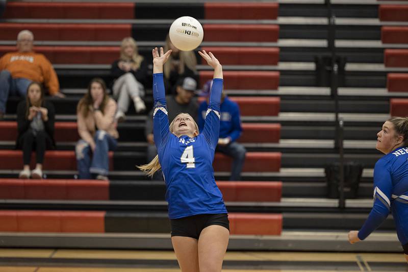 Newman’s Katie Grennan sets the ball in the semifinal sectional game Monday, Oct. 31, 2022 against Newark.