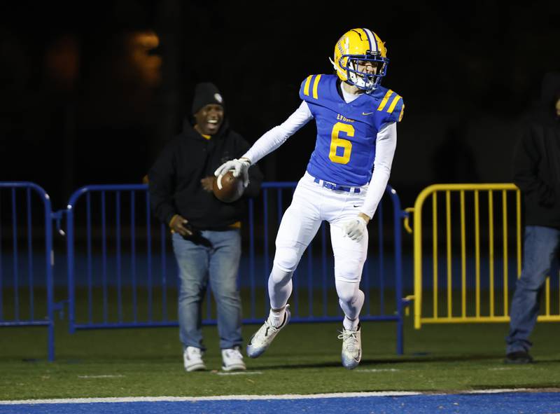 Lyons' Taylor Stamm (6) celebrates scoring a touchdown during the varsity football first-round 8A playoff game between York and Lyons Township on Friday, Oct. 31, 2025 in Western Springs, IL.