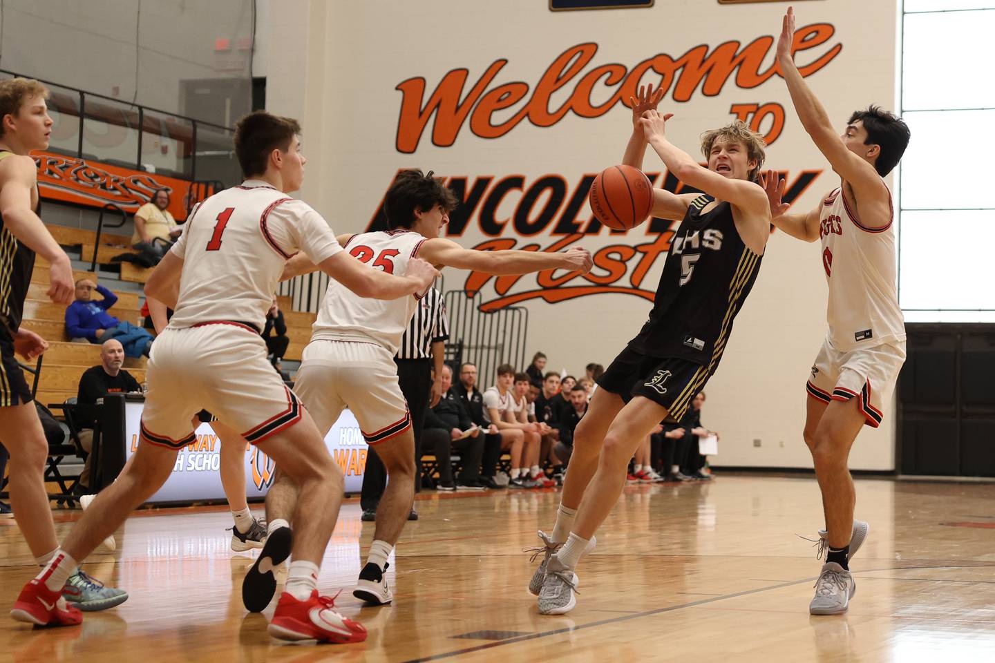 Lincoln-Way Central defense forces the turnover against Lemont’s Rokas Castillo in the Lincoln-Way West Warrior Showdown on Saturday January 28th, 2023.