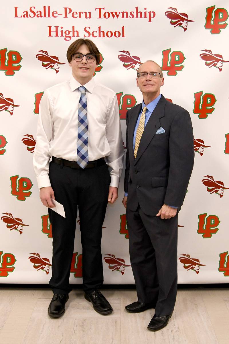 Will McLaughlin (left) received the $1,000 Ficek-Carboni Heritage Scholarship, which is awarded to a student with a cumulative GPA of at least 2.4 who plans to attend college and wrote an essay on the topic, "How the lessons I learned from my family have influenced my life." This scholarship was presented by Bill Carboni (right).