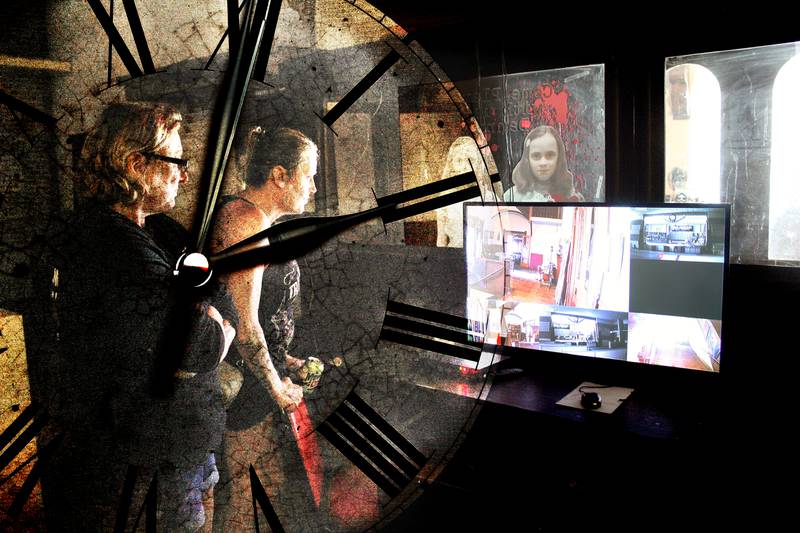 Jessica Finley (left) and her sister Angie Speed look over a security camera at the Pulford Opera House to try and detect paranormal presences.