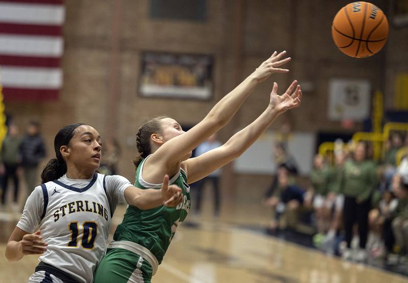 Sterling’s Nia Harris and Geneseo’s Viola Pettit look for the rebound Thursday, Jan. 30, 2025, at Sterling High School.