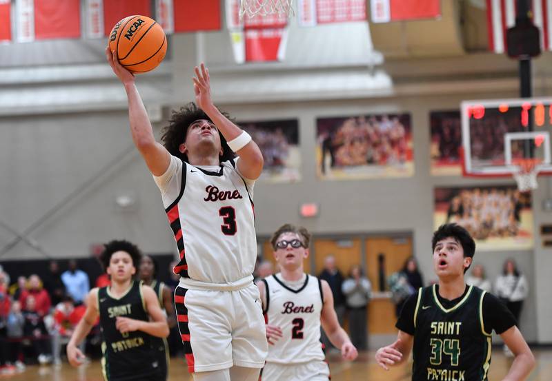 Benet’s Jayden Wright (3) lays the ball up as the first half ends to give the Redwings a two point lead during a game against St. Patrick on January 17, 2025 at Benet Academy in Lisle.