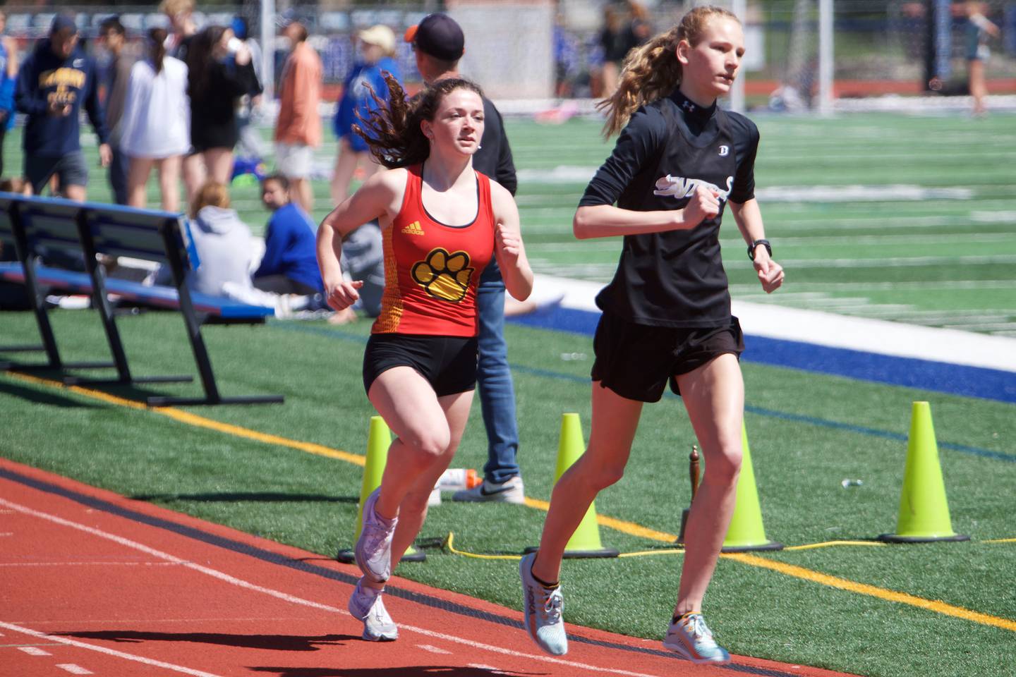 Glenbard North's Grace Schager and Batavia's Kat Schlenker compete in the 3200 meter run at the DuKane Girl's Conference meet at St. Charles North on May 7, 2022 in St. Charles.