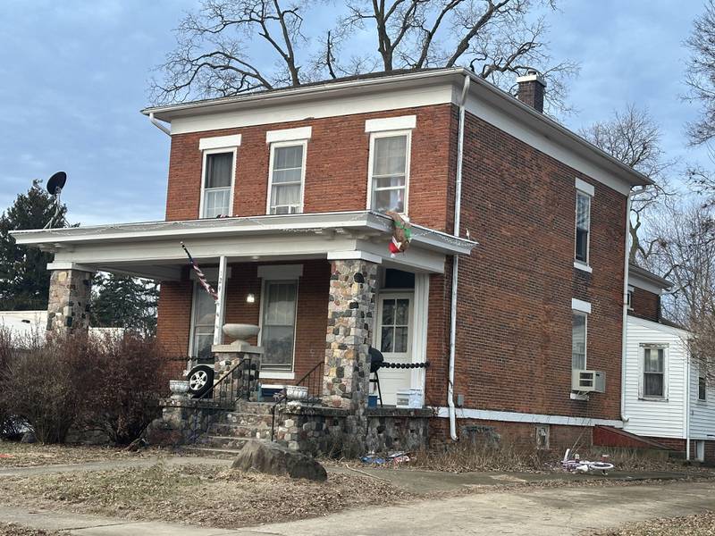 A view of the Charles A. Omen Home located in the 100 block of South Pleasant Street in Princeotn. It was built in 1880. The chains on the front porch came from the ancor of a ship according to local history. Omen was the owner of C.A. Omen Lumber Company locatted a block away from his home. j