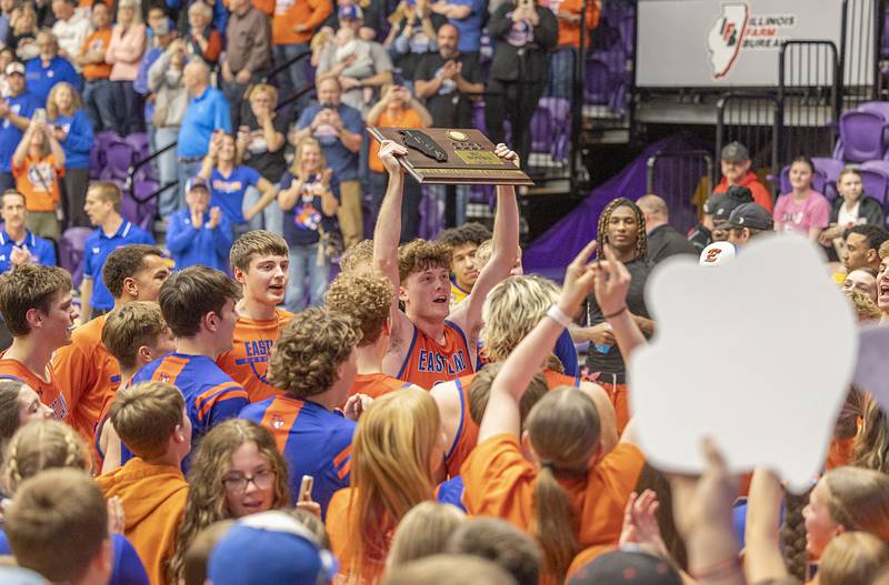 Eastland’s Braden Anderson hoists the plaque after defeating Tremont 47-45 Monday, March 9, 2026, in the Class 1A Macomb Supersectional.