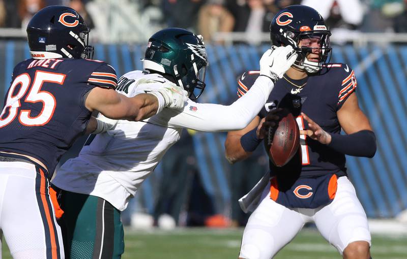 Chicago Bears quarterback Justin Fields is sacked by Philadelphia Eagles linebacker Haason Reddick during their game Sunday, Dec. 18, 2022, at Soldier Field in Chicago.