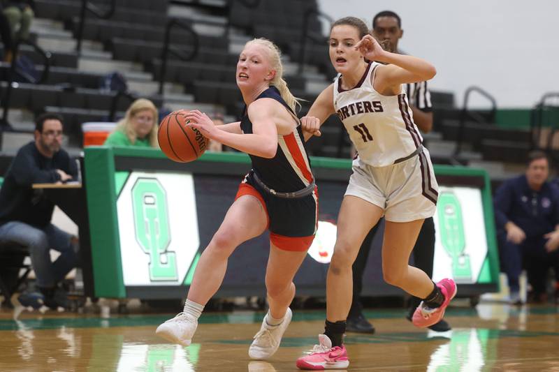 Romeoville’s Emily Gabrelcik drives past Lockport’s Laura Arstikaitis in the Oak Lawn Holiday Tournament championship on Saturday, Dec.16th in Oak Lawn.