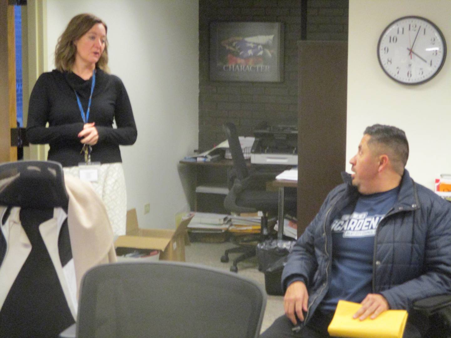 Candidate Cesar Cardenas talks with Joliet City Clerk Christa Desiderio as he submits petitions on Monday to run for city council in the April 4 election. Dec. 19, 2022.