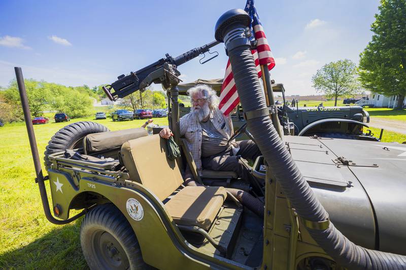 John Ayres schools visitors on his vehicles on display Saturday, May 16, 2026, at Franklin Grove’s Chaplin Creek World War II reenactment. Actors portrayed the Battle of Anzio, a campaign that took place in Italy between Allied and Axis troops in 1944.