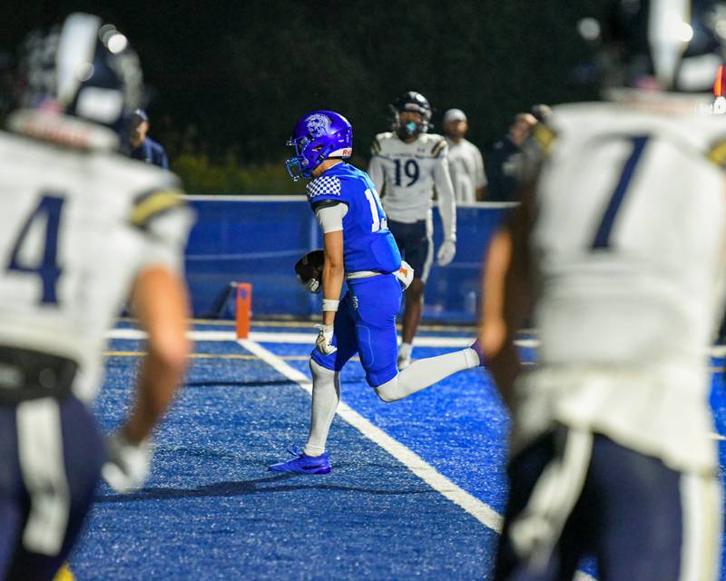 St. Francis's Blayke Lohmann (15) runs into the endzone on Friday Oct. 3, 2025, while taking on IC Catholic Prep held at St. Francis High School.