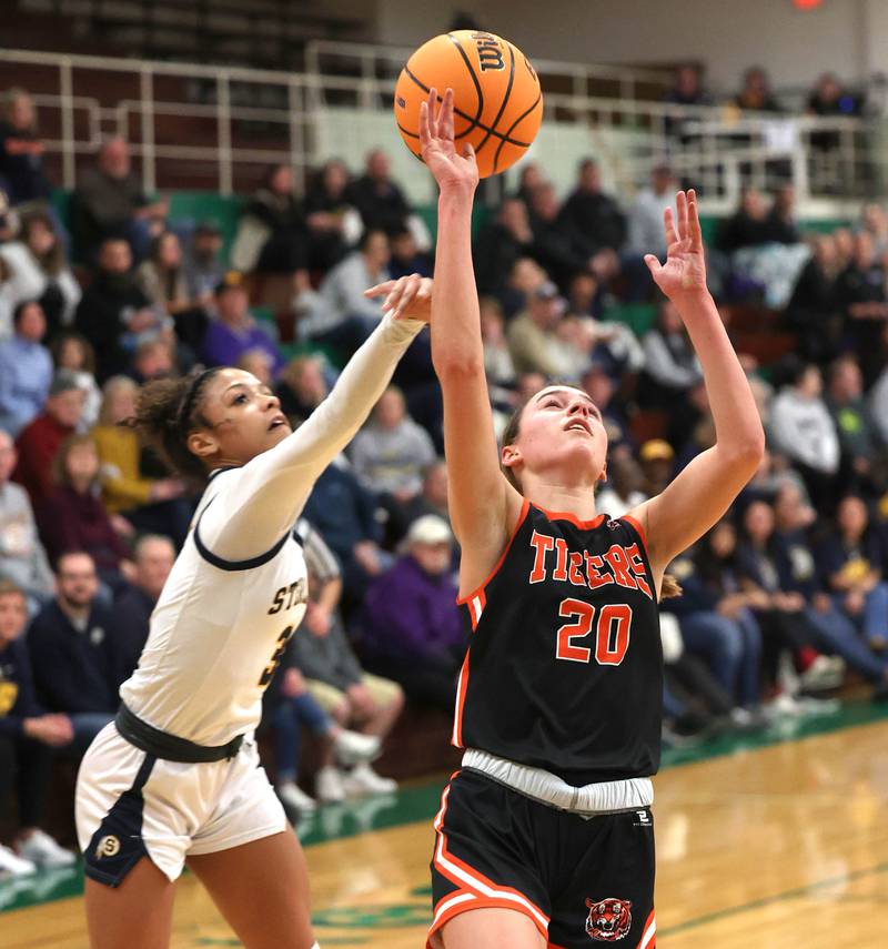 Crystal Lake Central's Hadley Ferrero has her shot blocked from behind by Sterling's Delali Amankwa during their Class 3A sectional semifinal game Tuesday, Feb. 25, 2025, at Boylan Catholic High School in Rockford.