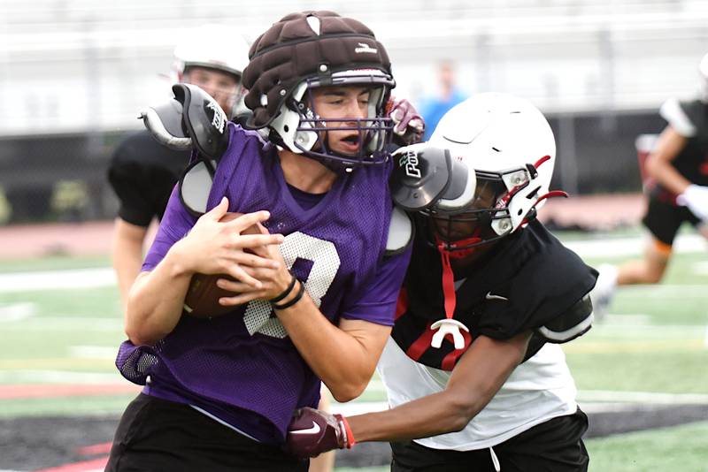 Wilmington's Ryan Kettman, left, bounces off Bradley-Bourbonnais' Kaden Bowens during a joint summer workout at Bradley-Bourbonnais Wednesday, July 16, 2025.