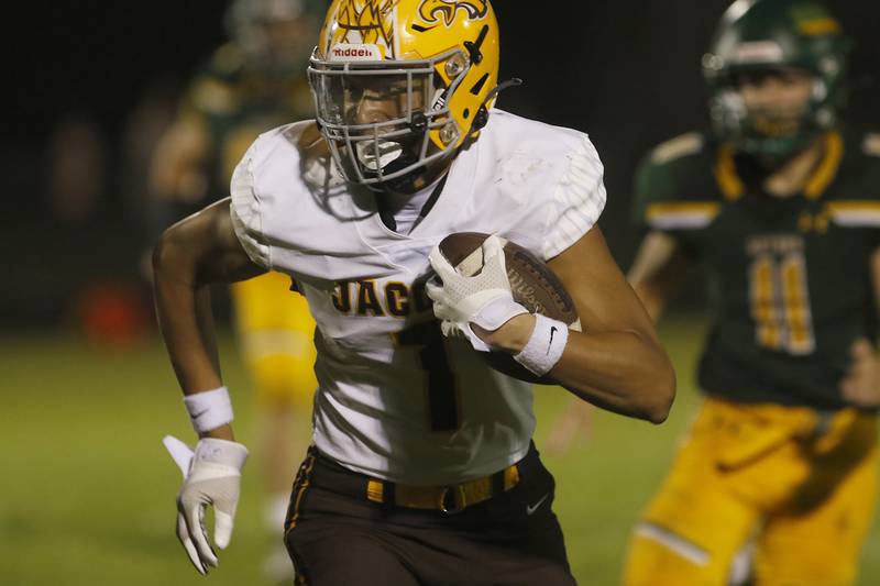 Jacobs’ Nick True runs for a touchdown after catching a pass during a Fox Valley Conference football game Friday, Aug. 26, 2022, between Crystal Lake South and Jacobs at Crystal Lake South High School.