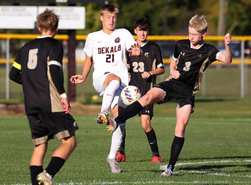 DeKalb's Brayden Adams and Sycamore's Paxton Nicol make a play on the ball during the El Classicorn rivalry game Tuesday, Oct. 7, 2025, at Sycamore High School.
