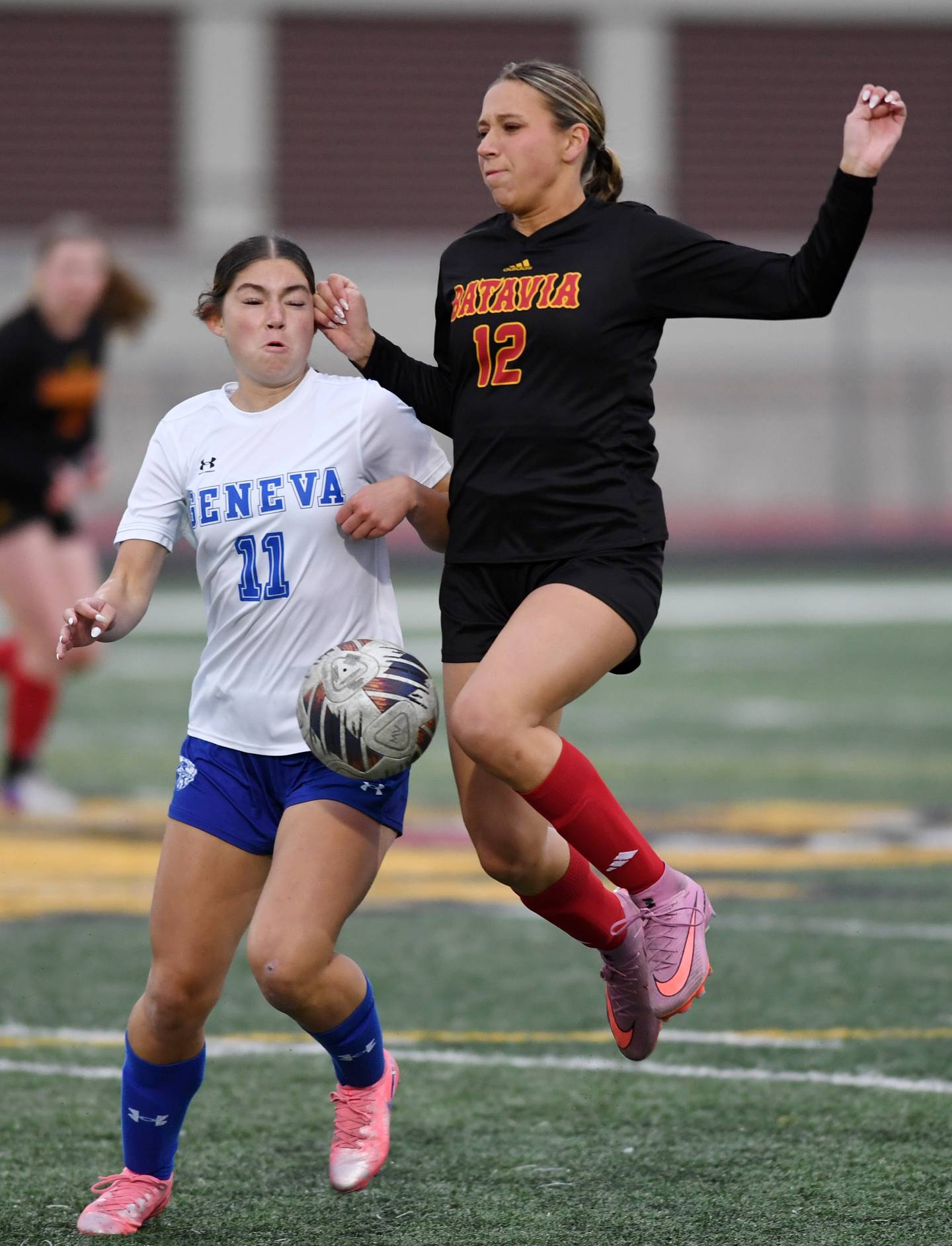Geneva’s Bridget Burke, left, and Batavia’s Payton Haslett both try to control a bouncing ball during Tri-Cities soccer night on Tuesday, May 5, 2026 in Batavia.