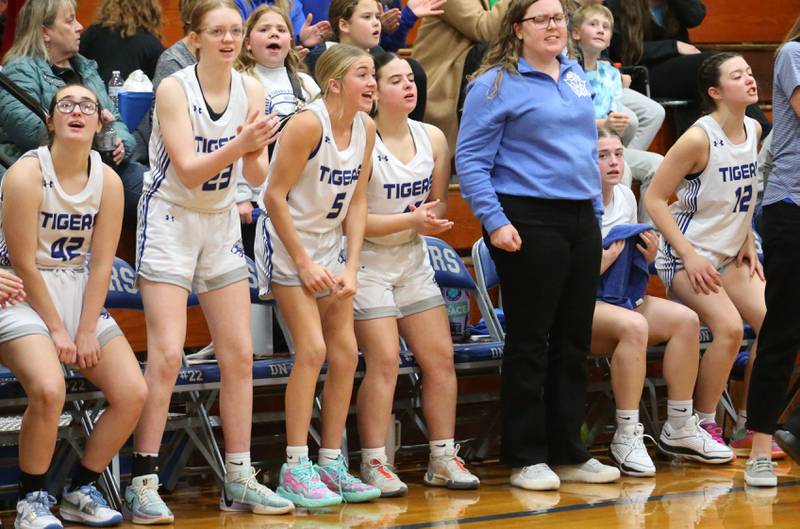 Members of the Princeton girls basketball team react after scoring a basket against Hall during the Princeton Holiday Girls Basketball Tournament on Friday, Nov. 23, 2024 at Princeton High School.