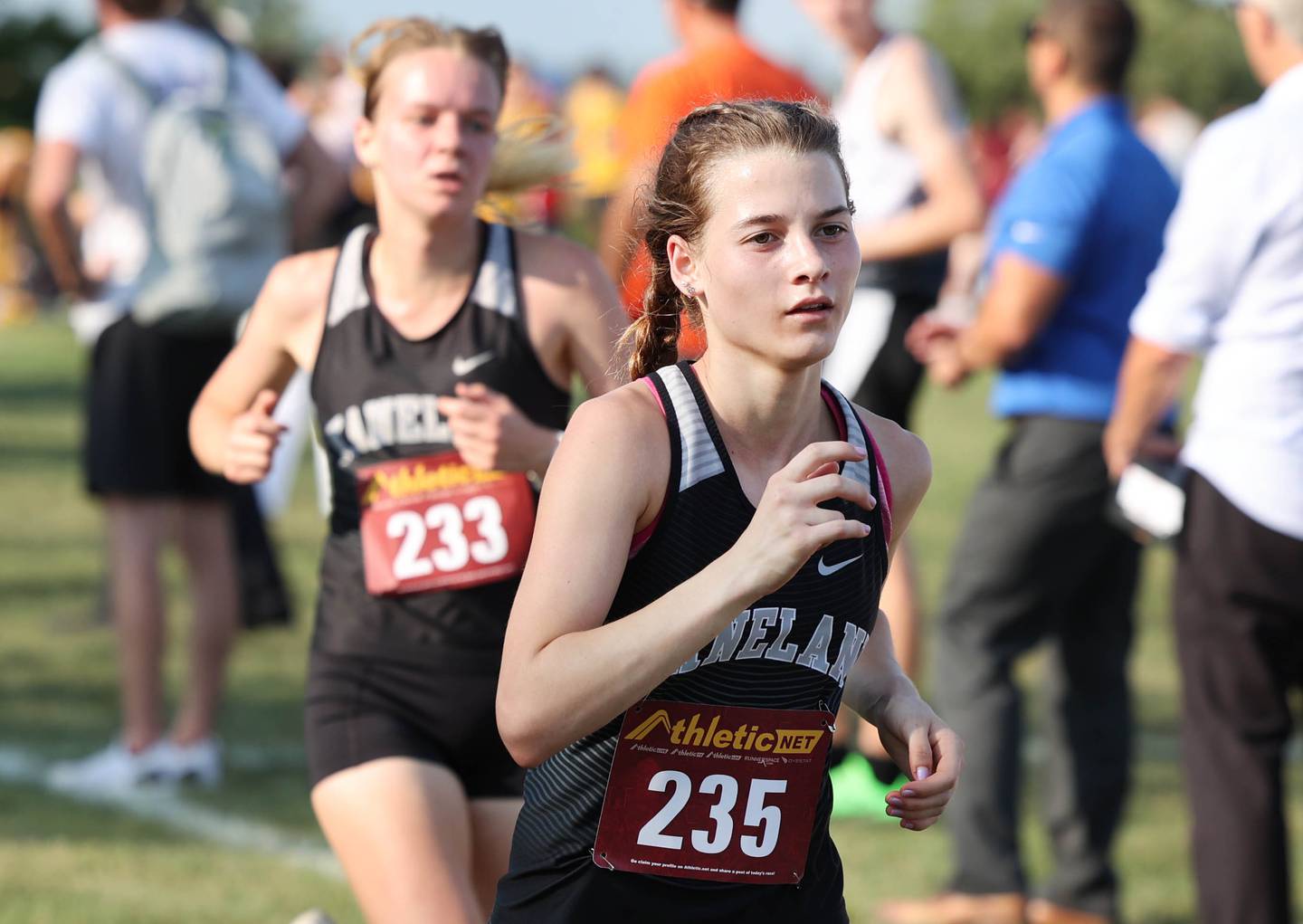 Kaneland’s Danielle Bower (front) and Abby Fitts sprint to the finish during the Sycamore Cross Country Invitational Tuesday, Aug. 29, 2023, at Kishwaukee College in Malta.