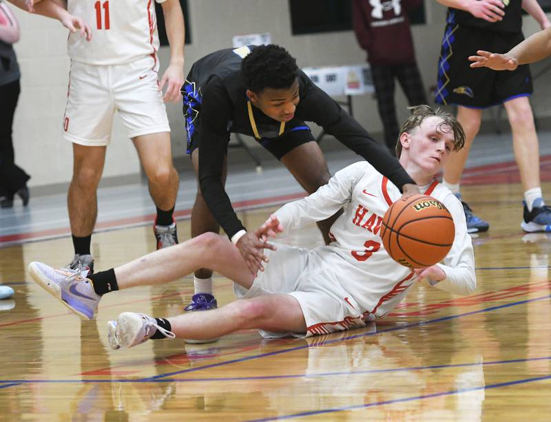 Oregon's Jordan Croegaert (3) and Rockford Christian's Kevion Cummings go after a loose ball during Jan. 6 action at the Blackhawk Center.