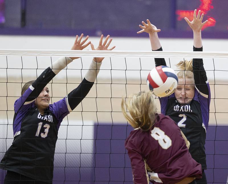 Dixon’s Madyson Tichler blocks a shot by Morris’ Ayla Phillips Thursday, Oct. 31, 2024 in the class 3A regional championship at Dixon High School.
