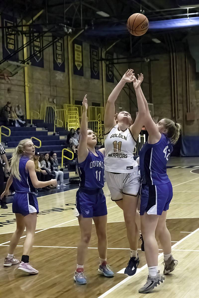 Sterling’s Kathryn Rowzee works below the basket against Quincy Saturday, Jan. 28, 2023.