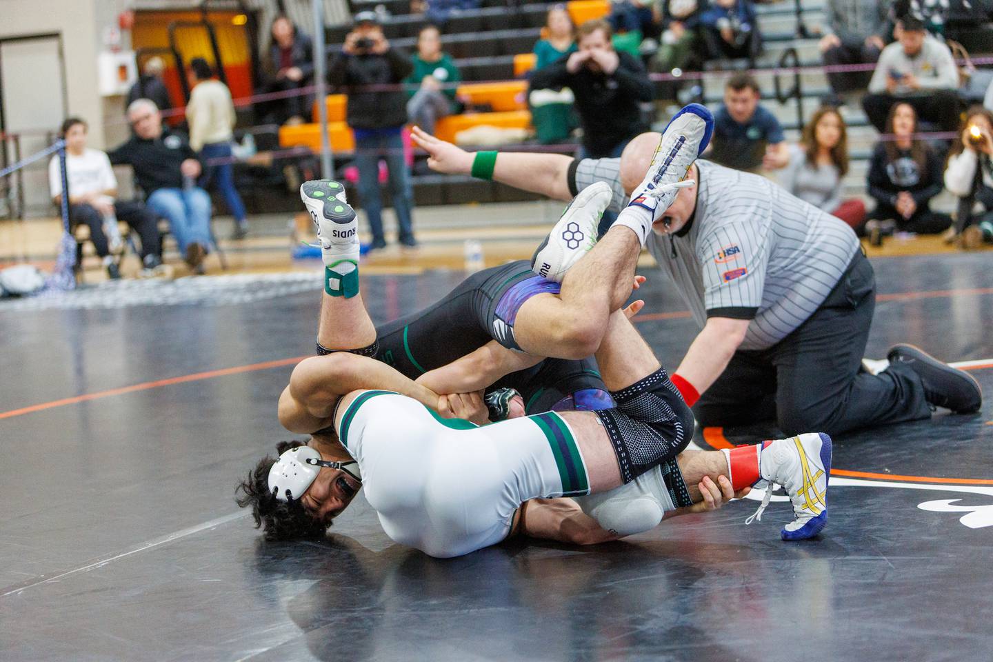 Glenbard West's Jondelle Malunay competes in the 157 lb Championship match with Bartlett's Cameron Engels at the St. Charles East Class 3A Regional on Saturday, Jan. 31,2026 in St. Charles.