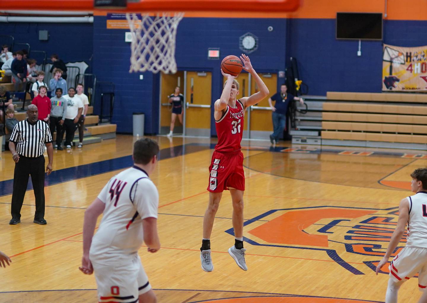 Yorkville's Jason Jakstys (32) shoots a three pointer against Oswego during a basketball game at Oswego High School on Saturday, Jan 27, 2024.