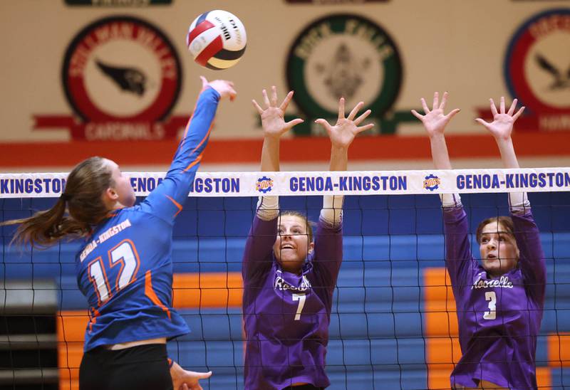 Genoa-Kingston's Jessie Fredrickson tries to spike the ball by Rochelle's Meredith Bruns (left) and Kyrie Cragin during their match Monday, Sept. 15, 2025, at Genoa-Kingston High School.