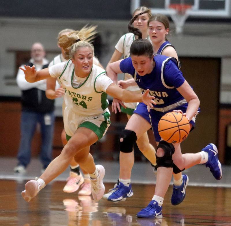 Crystal Lake South’s Gracey LePage, left, races Geneva’s Keira McCann for the ball in girls IHSA Class 3A Sectional Championship basketball on Thursday, Feb. 26, 2026, at Crystal Lake Central High School in Crystal Lake.