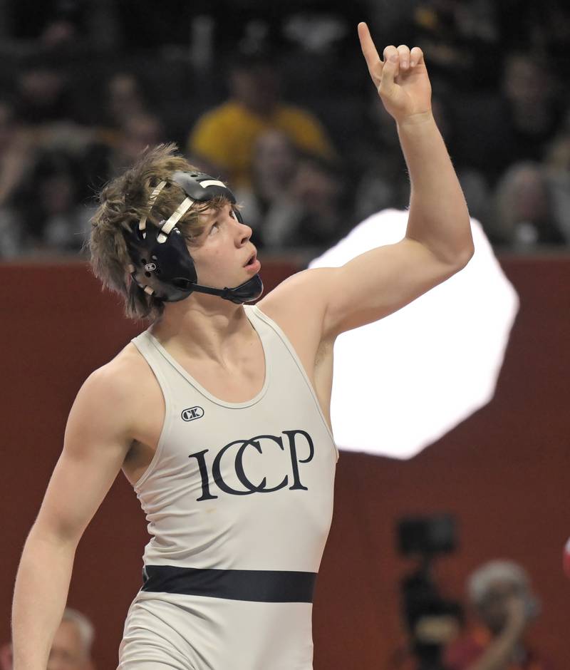 IC Catholic’s Aiden Arnett celebrates his championship win in the Class 2A 150-pound bout at the boys IHSA wrestling finals at State Farm Center in Champaign on Saturday, Feb. 21, 2026.