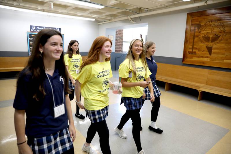 Nazareth Academy student leaders help incoming freshmen  navigate the hallways of the La Grange Park school on Friday, Aug. 16, 2024 as part of Freshman Orientation.