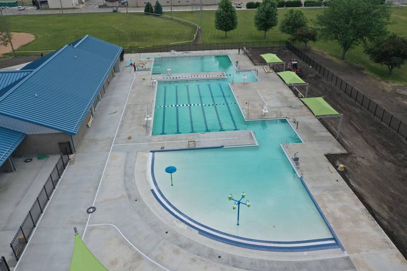 Workers fill Riordan Pool on Tuesday, June 13, 2023 in Ottawa. The pool will open June 19 to the public. The construction of the 6.7 million dollar pool began in September of 2022. The facility includes a 9,700 square foot pool, complete with a zero foot entry, six 70-foot competition lanes and three diving stands, plus a 5,700 square foot building containing private family changing rooms, locker rooms, showers, restrooms and offices.
There will be a shelter with picnic tables, vending machines and tables for umbrellas.